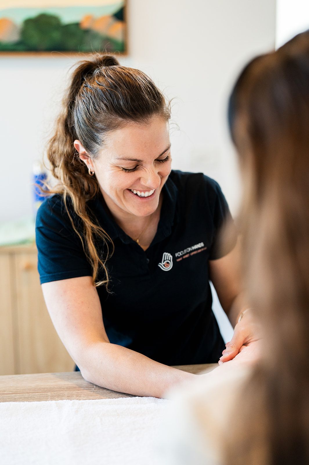 Danielle Crestani smiling during a hand therapy session